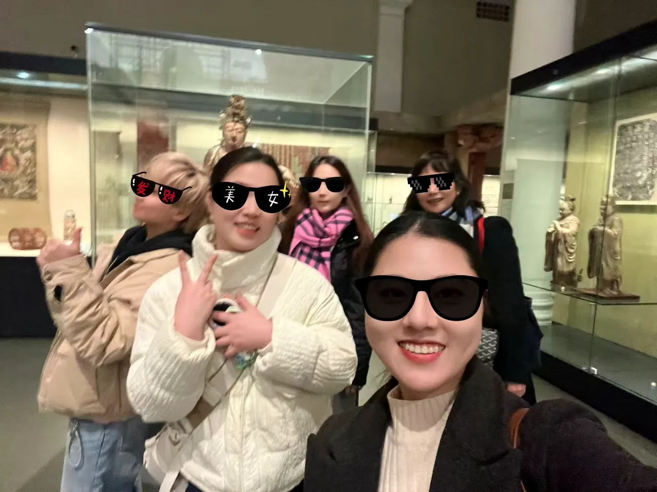 Students taking a group photo at a museum activity