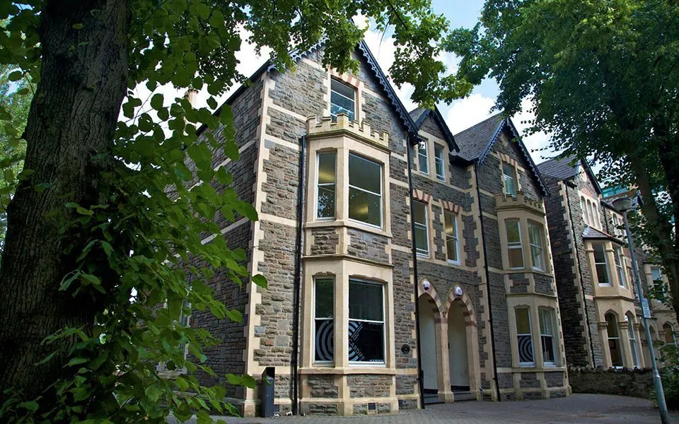 Celtic English Academy — A multi-storey school building beside trees