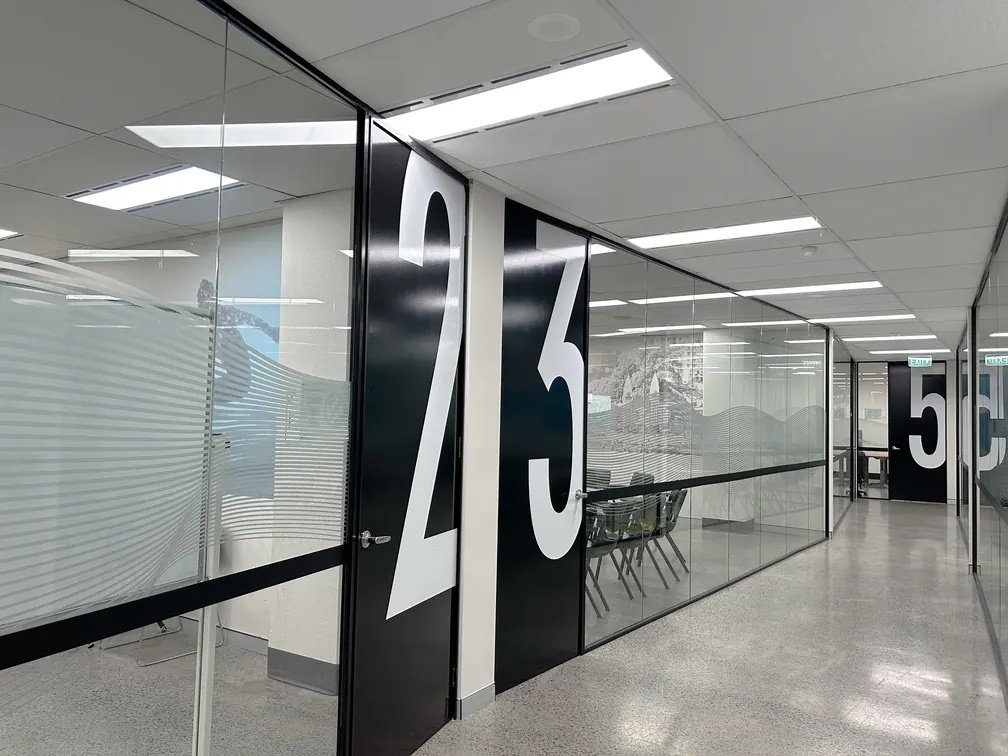A corridor and glazed classroom entrance at the OHC Sydney campus.